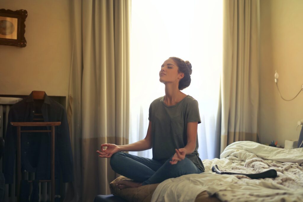 woman meditating in order to cope with weight gain in eating disorder recovery