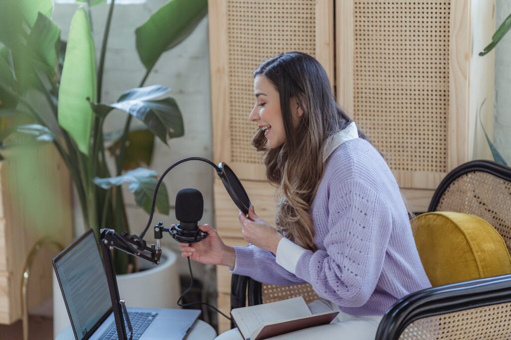 Photo of a woman recording an eating disorder recovery podcast.