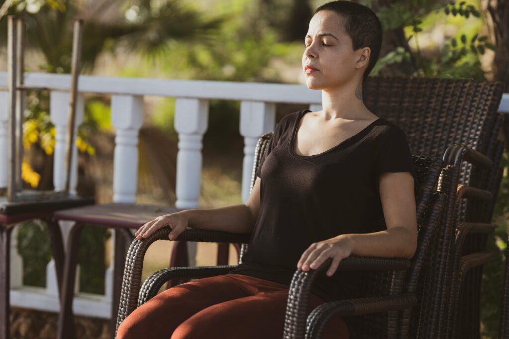 Person practicing mindfulness meditation, representing a CBT technique for reducing distress and fostering self-awareness in eating disorder recovery.