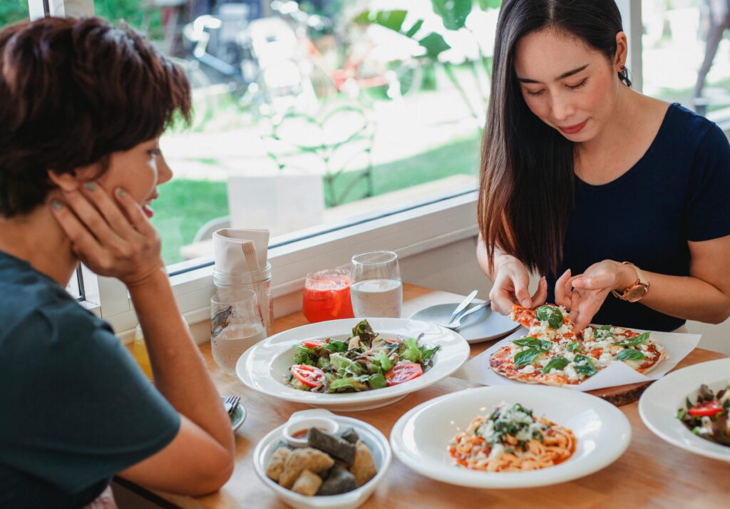 Two people eating together, symbolizing exposure therapy for overcoming fear foods in eating disorder recovery.